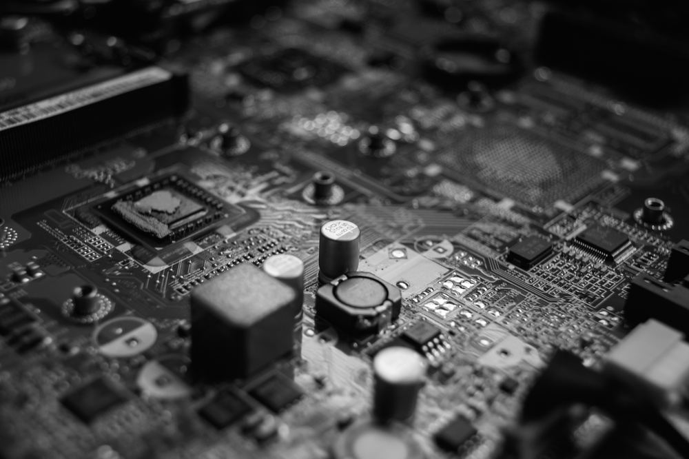 Black-and-white close-up of a computer motherboard